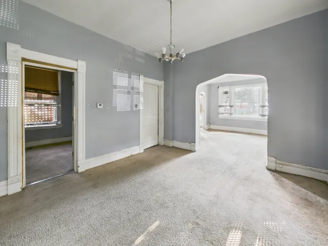 a white toilet sitting next to a bathroom sink