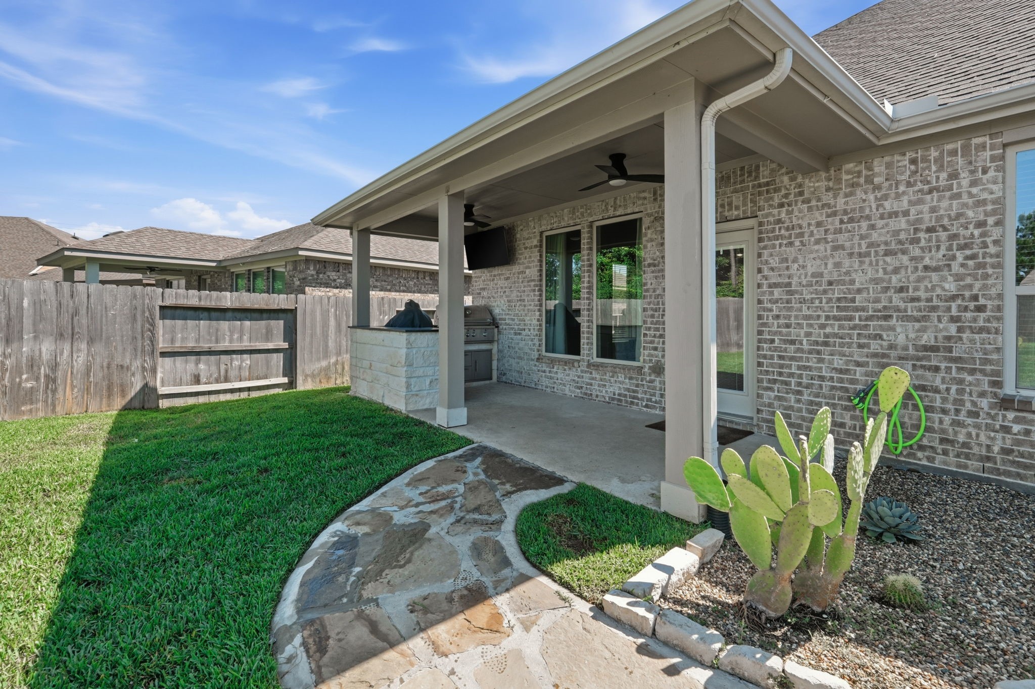 4334 Umber Shadow Drive Spring, TX 77386 - Photo 32 of 45 Covered patio overlooks the backyard and features ample space for outdoor dining, entertaining, and everyday relaxation.