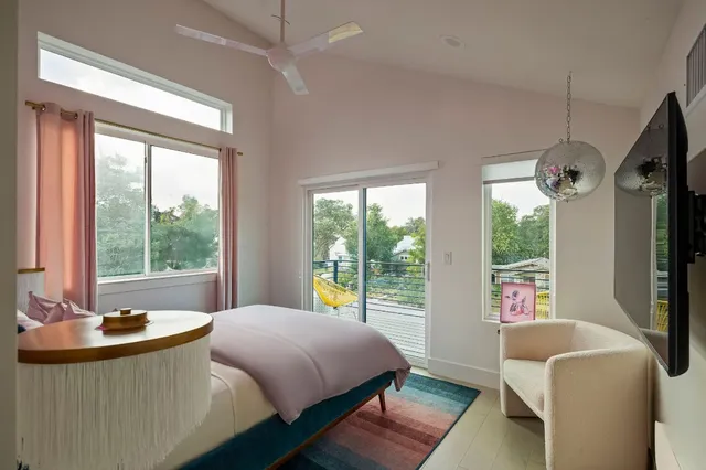 a bedroom with a bed and a couch