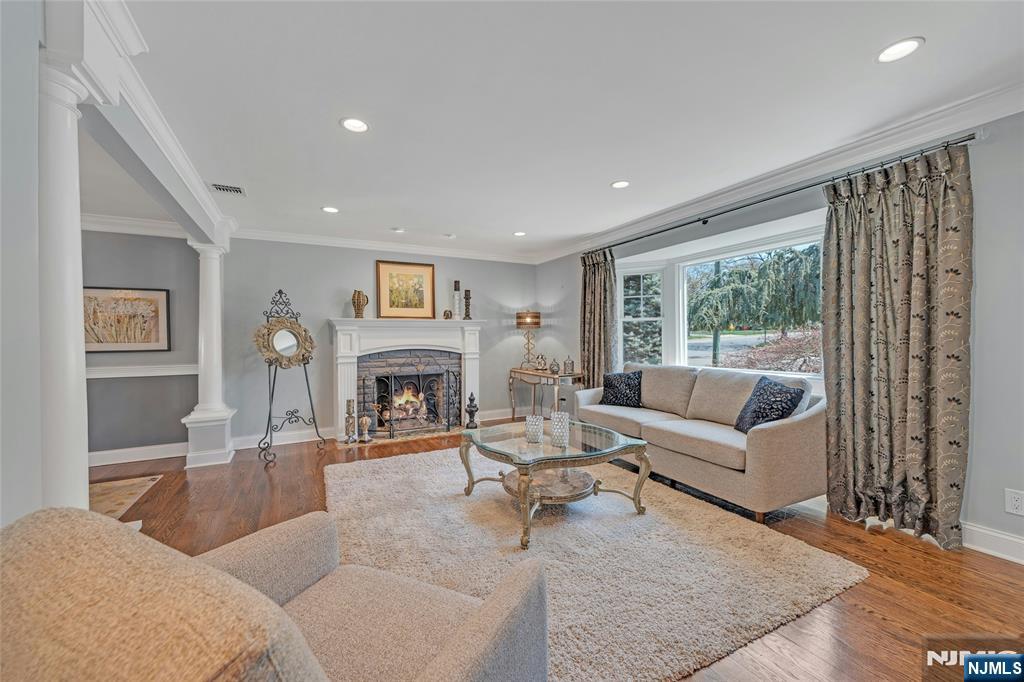 117 Wanamaker Avenue Oradell, NJ 07649 - Photo 11 of 49 a living room with furniture large window and a fireplace