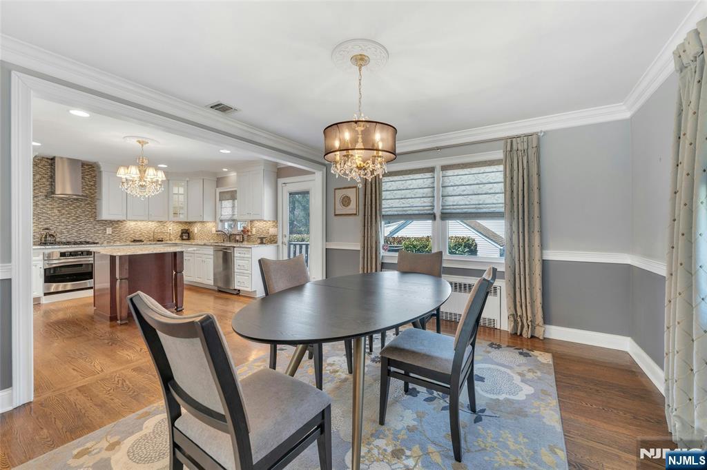 117 Wanamaker Avenue Oradell, NJ 07649 - Photo 13 of 49 a dining room with furniture a chandelier and wooden floor