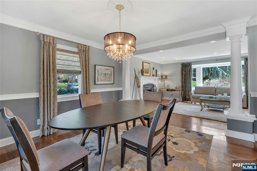 117 Wanamaker Avenue Oradell, NJ 07649 - Photo 15 of 49 a view of a dining room with furniture a chandelier and wooden floor