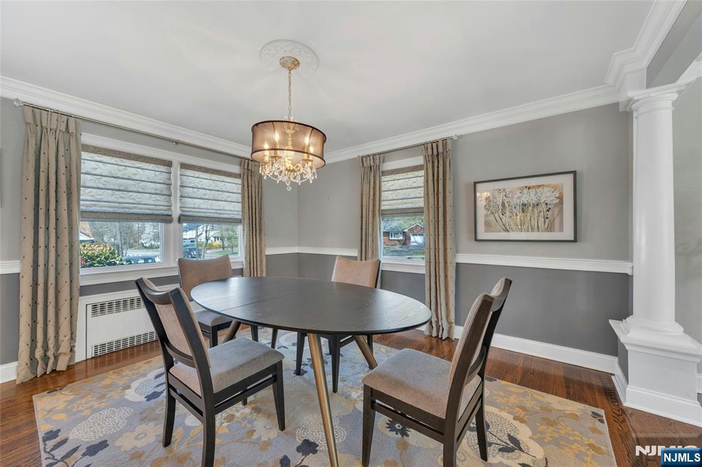 117 Wanamaker Avenue Oradell, NJ 07649 - Photo 16 of 49 a view of a dining room with furniture wooden floor and a chandelier