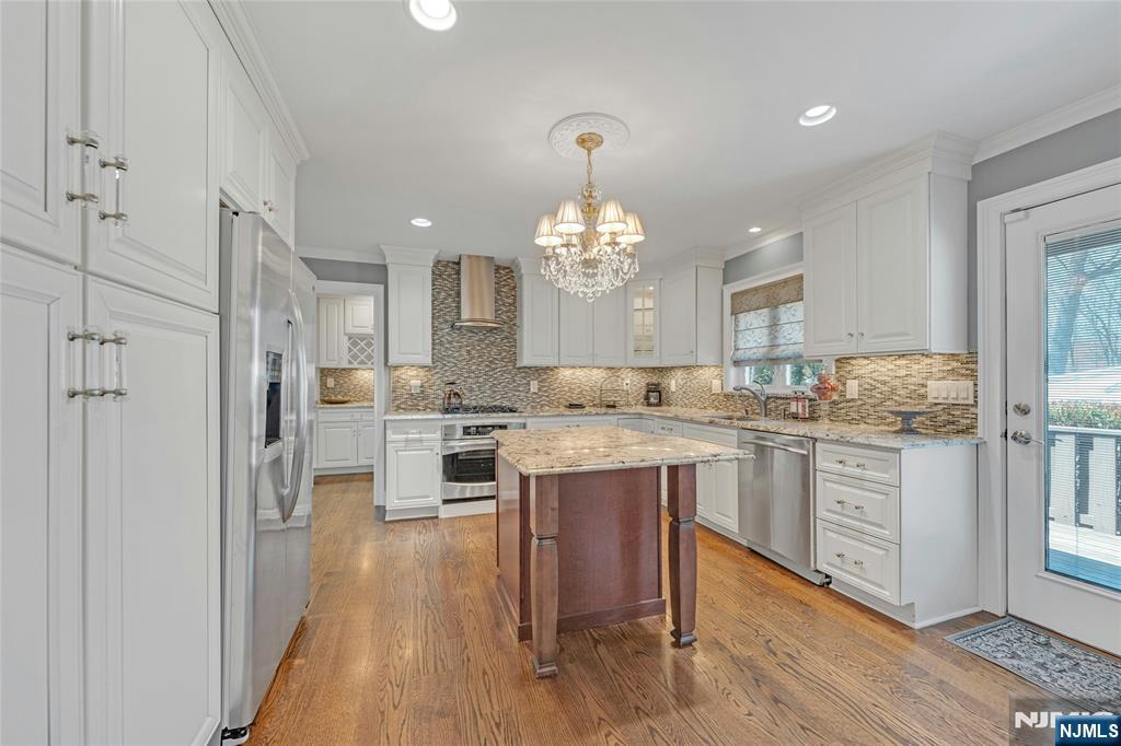 117 Wanamaker Avenue Oradell, NJ 07649 - Photo 17 of 49 a large kitchen with cabinets wooden floor and stainless steel appliances