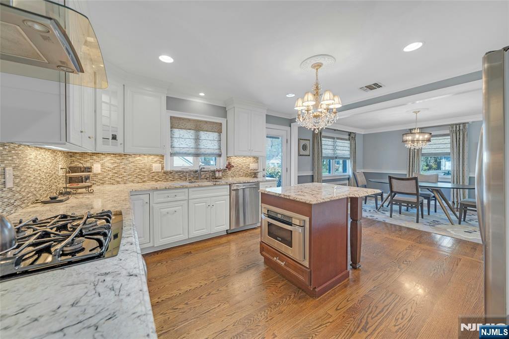 117 Wanamaker Avenue Oradell, NJ 07649 - Photo 19 of 49 a kitchen with stove and cabinets