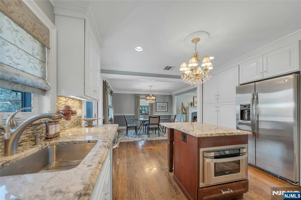 117 Wanamaker Avenue Oradell, NJ 07649 - Photo 20 of 49 a kitchen with a stove a sink and a refrigerator