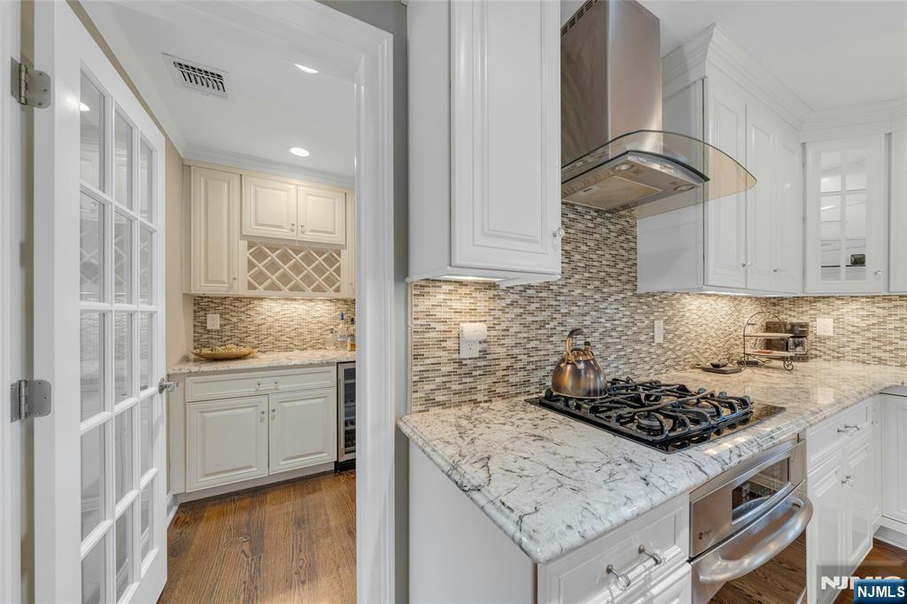 117 Wanamaker Avenue Oradell, NJ 07649 - Photo 21 of 49 a kitchen with stainless steel appliances granite countertop a stove a sink and a refrigerator