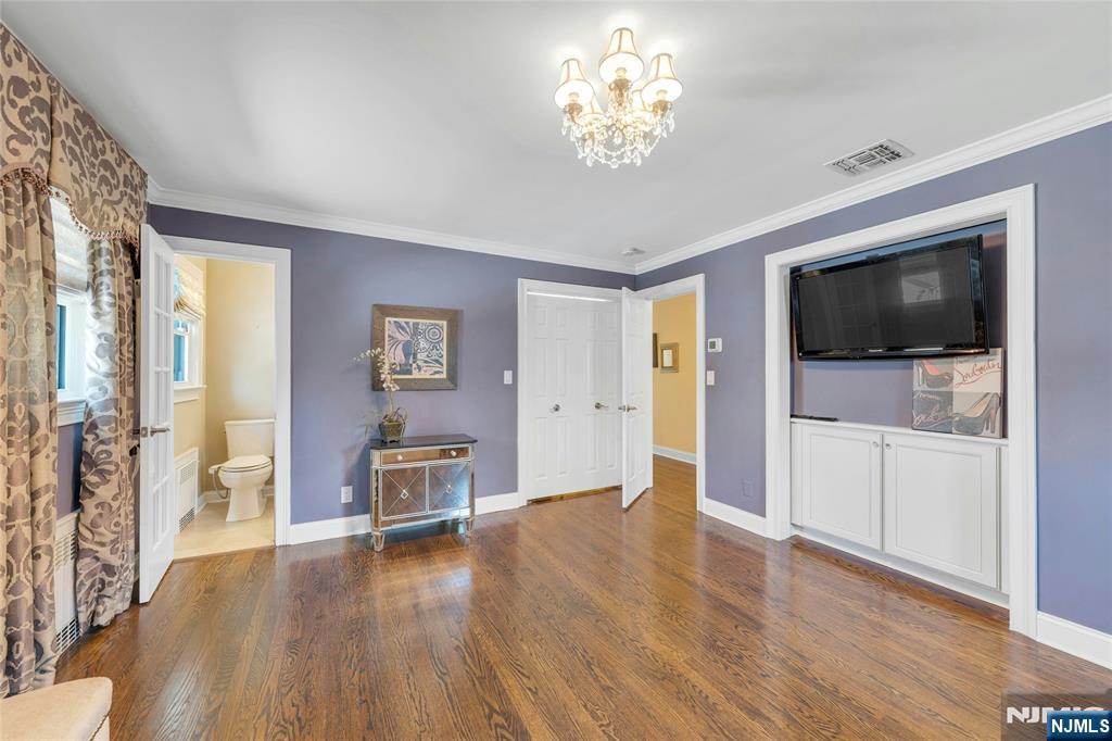 117 Wanamaker Avenue Oradell, NJ 07649 - Photo 26 of 49 a view of a livingroom with furniture wooden floor chandelier and windows