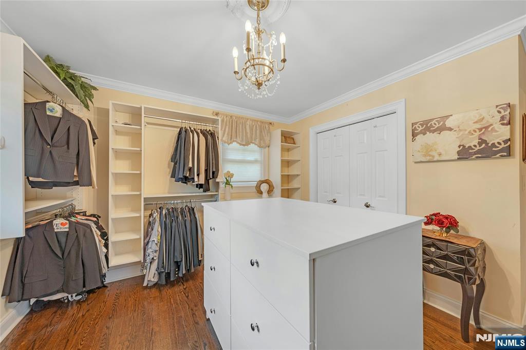 117 Wanamaker Avenue Oradell, NJ 07649 - Photo 30 of 49 a view of walk in closet with clothes and shoes