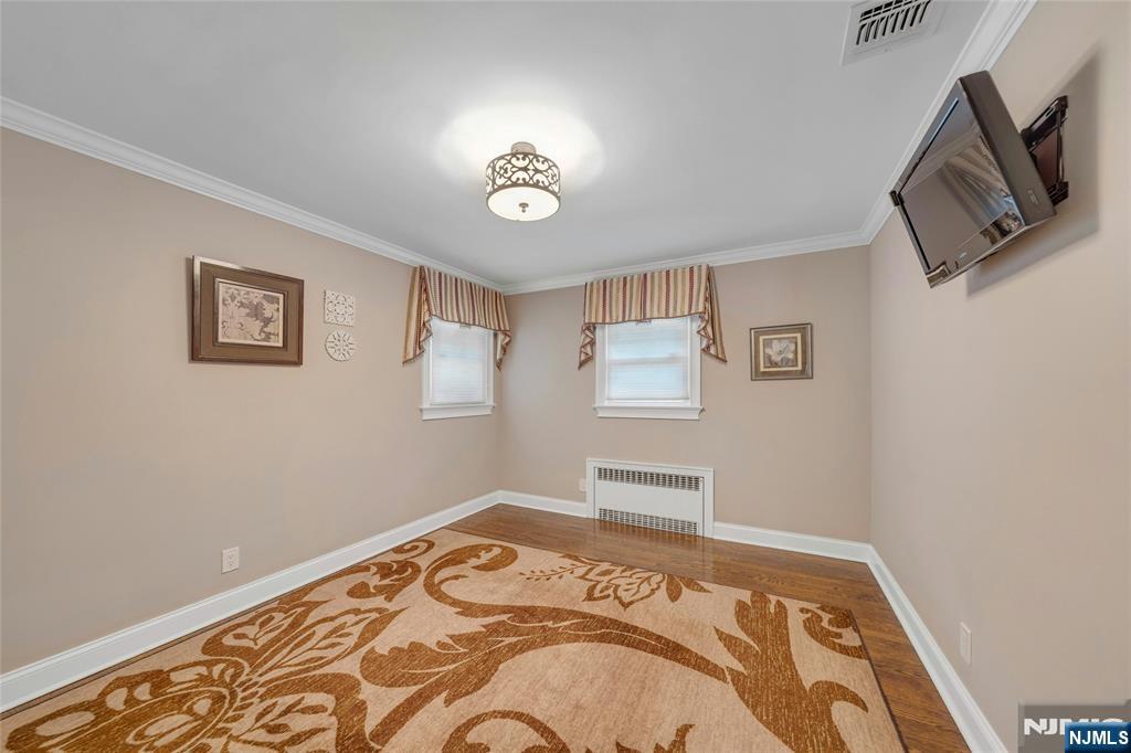 117 Wanamaker Avenue Oradell, NJ 07649 - Photo 32 of 49 a bedroom with a bed and a tv