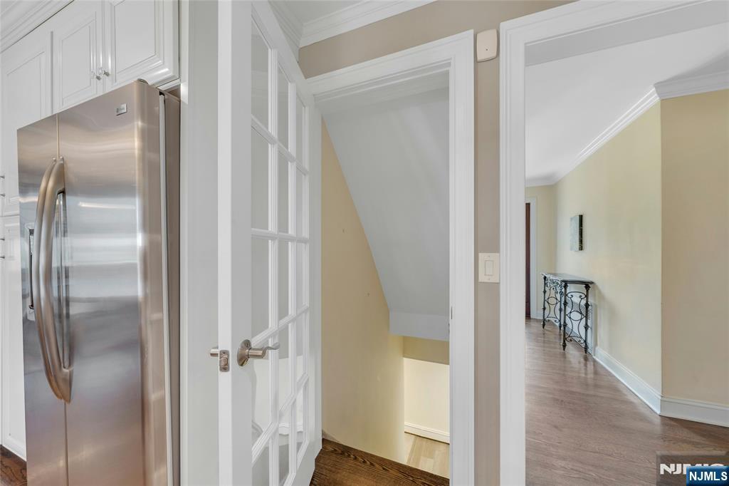 117 Wanamaker Avenue Oradell, NJ 07649 - Photo 33 of 49 a view of a hallway with wooden floor and staircase
