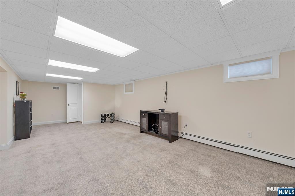 117 Wanamaker Avenue Oradell, NJ 07649 - Photo 35 of 49 an empty room with a table and a chair