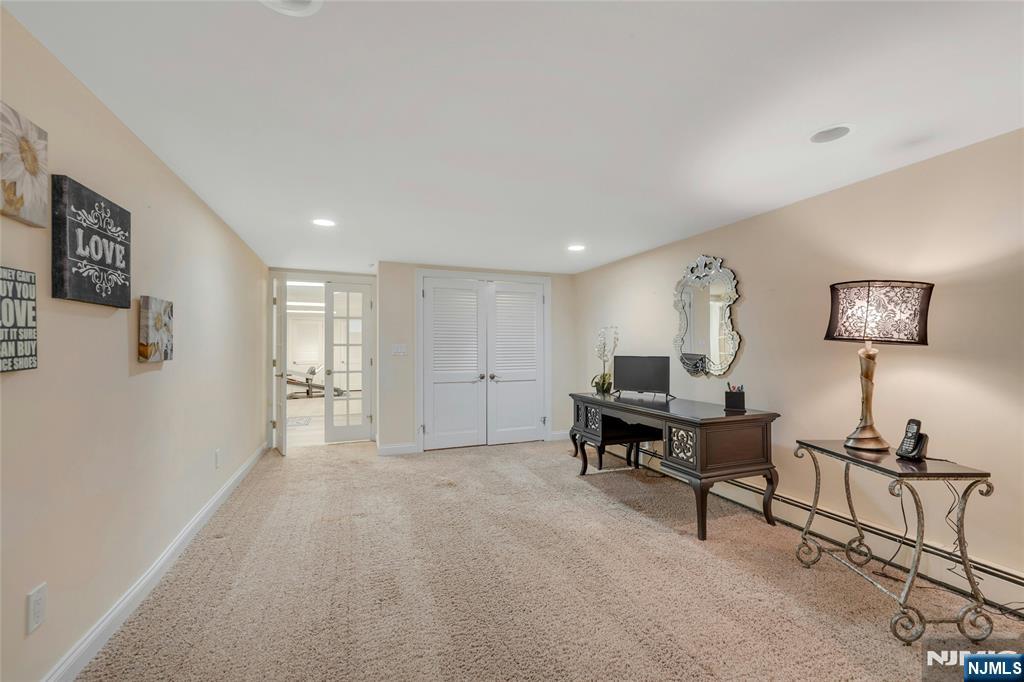 117 Wanamaker Avenue Oradell, NJ 07649 - Photo 37 of 49 a living room with furniture and a table