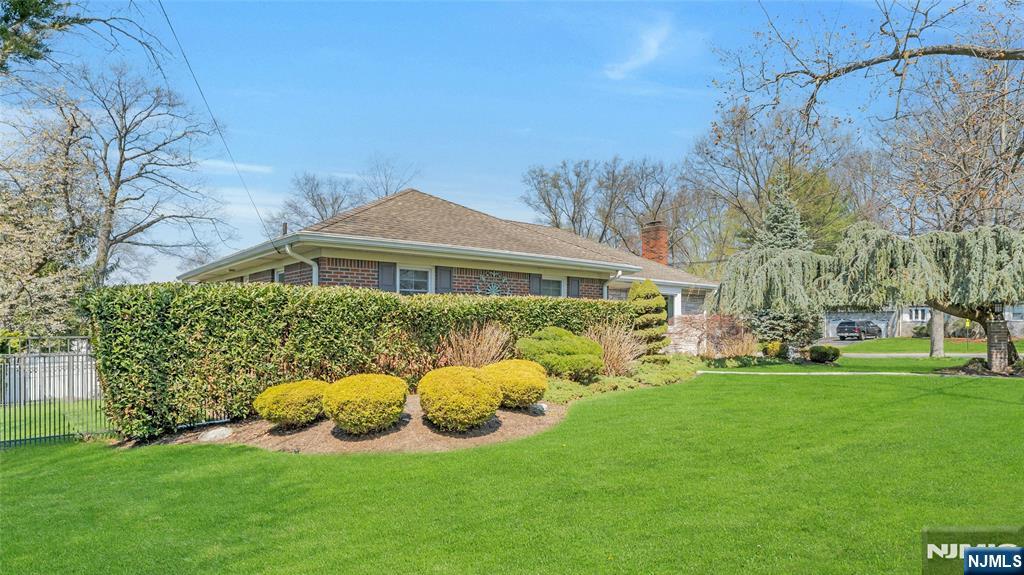 117 Wanamaker Avenue Oradell, NJ 07649 - Photo 41 of 49 a view of a house with a backyard and a garden