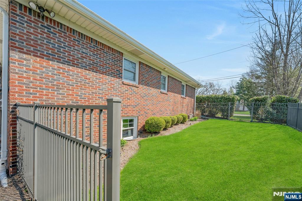 117 Wanamaker Avenue Oradell, NJ 07649 - Photo 44 of 49 a view of a backyard with a garden