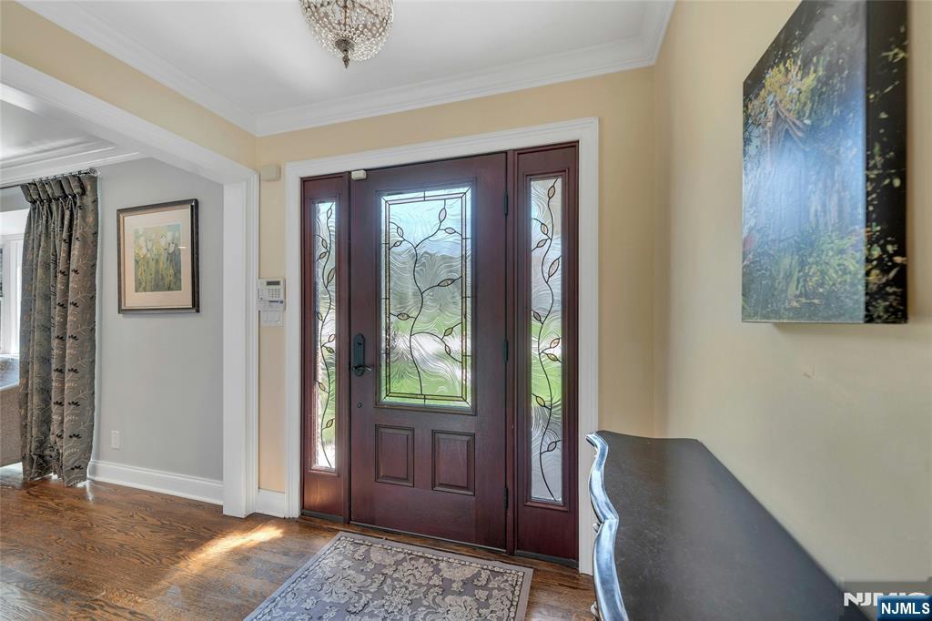 117 Wanamaker Avenue Oradell, NJ 07649 - Photo 5 of 49 a view of a hallway with wooden floor and windows
