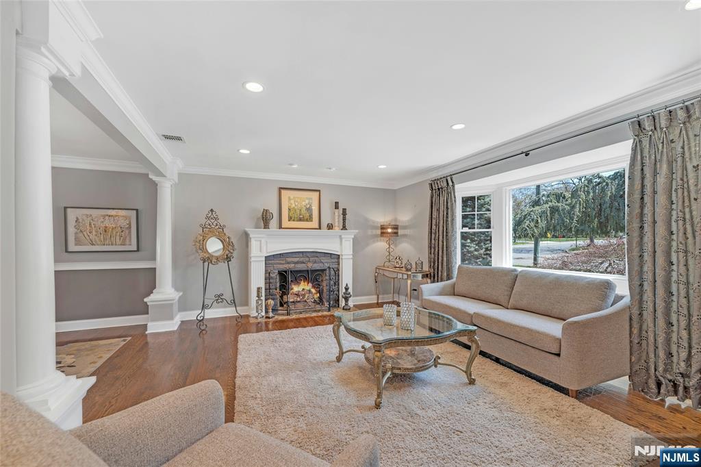 117 Wanamaker Avenue Oradell, NJ 07649 - Photo 6 of 49 a living room with furniture and a fireplace