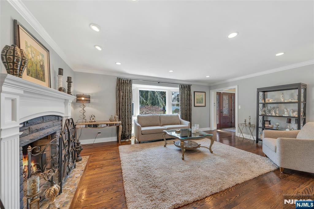 117 Wanamaker Avenue Oradell, NJ 07649 - Photo 8 of 49 a living room with furniture and a fireplace