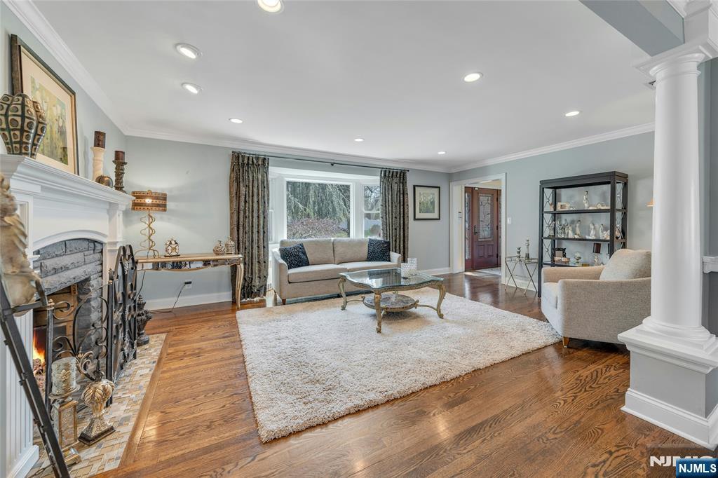 117 Wanamaker Avenue Oradell, NJ 07649 - Photo 10 of 49 a living room with furniture and a fireplace