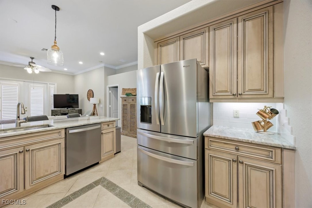9159 Spring Mountain Way Fort Myers, FL 33908 - Photo 11 of 48 a kitchen with appliances cabinets and a sink