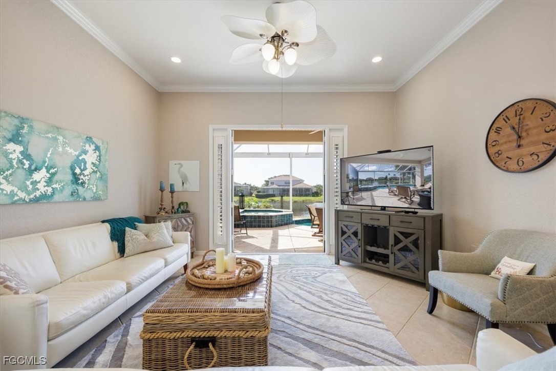 9159 Spring Mountain Way Fort Myers, FL 33908 - Photo 16 of 48 a living room with furniture and a fireplace