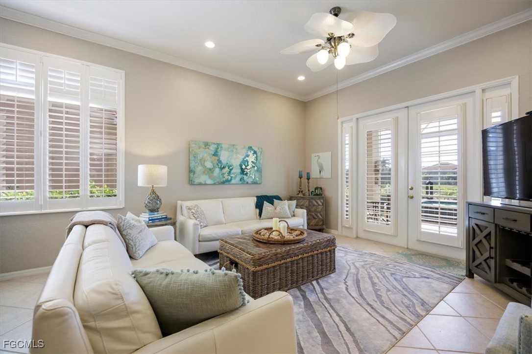 9159 Spring Mountain Way Fort Myers, FL 33908 - Photo 17 of 48 a living room with furniture and a fireplace