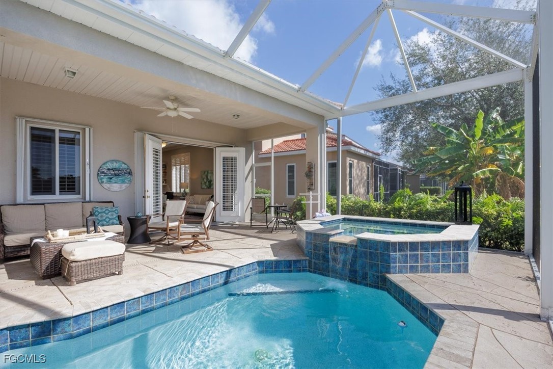 9159 Spring Mountain Way Fort Myers, FL 33908 - Photo 21 of 48 a building outdoor space with patio furniture and potted plants