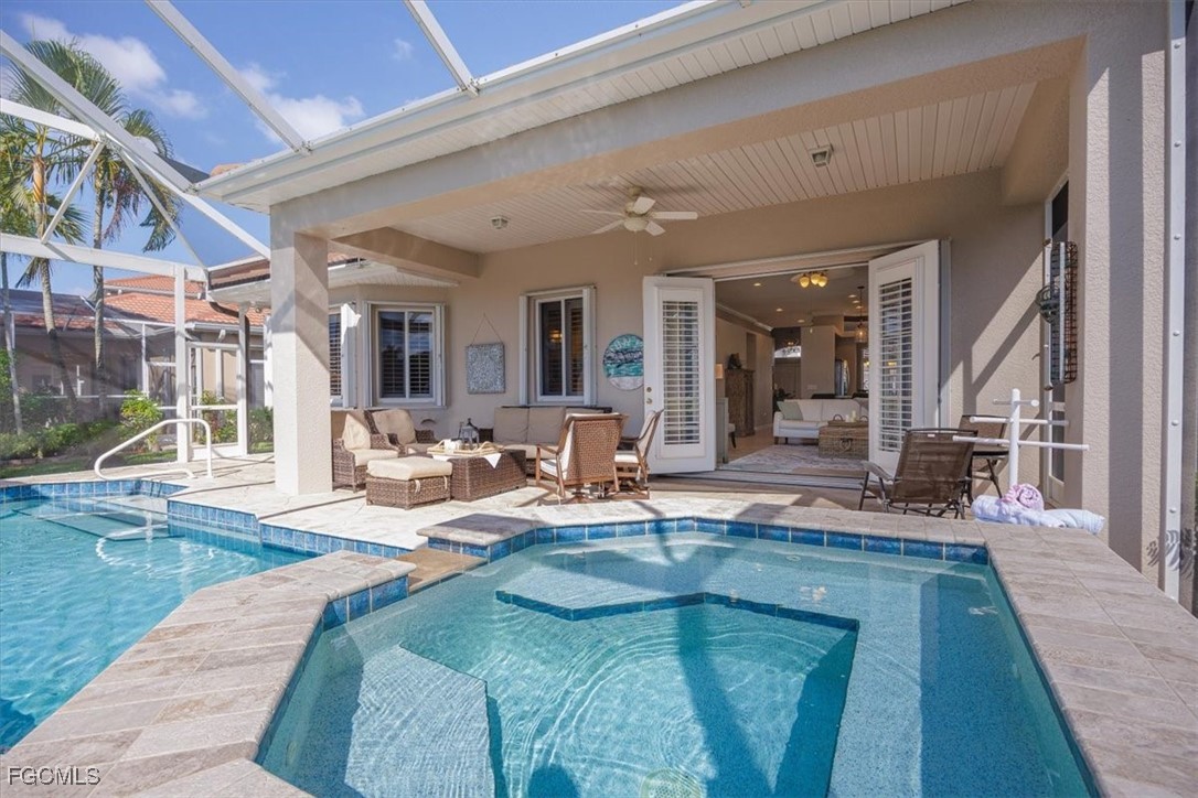 9159 Spring Mountain Way Fort Myers, FL 33908 - Photo 23 of 48 a living room with fireplace furniture and a rug