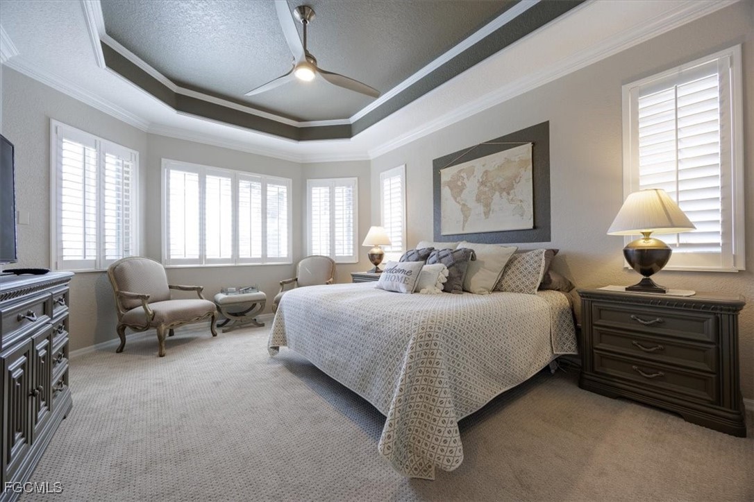 9159 Spring Mountain Way Fort Myers, FL 33908 - Photo 27 of 48 a bedroom with bed and window