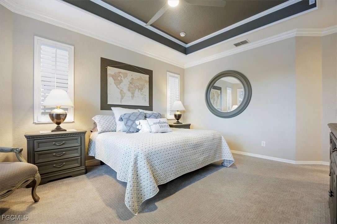 9159 Spring Mountain Way Fort Myers, FL 33908 - Photo 28 of 48 a bedroom with a bed lamp closet and window