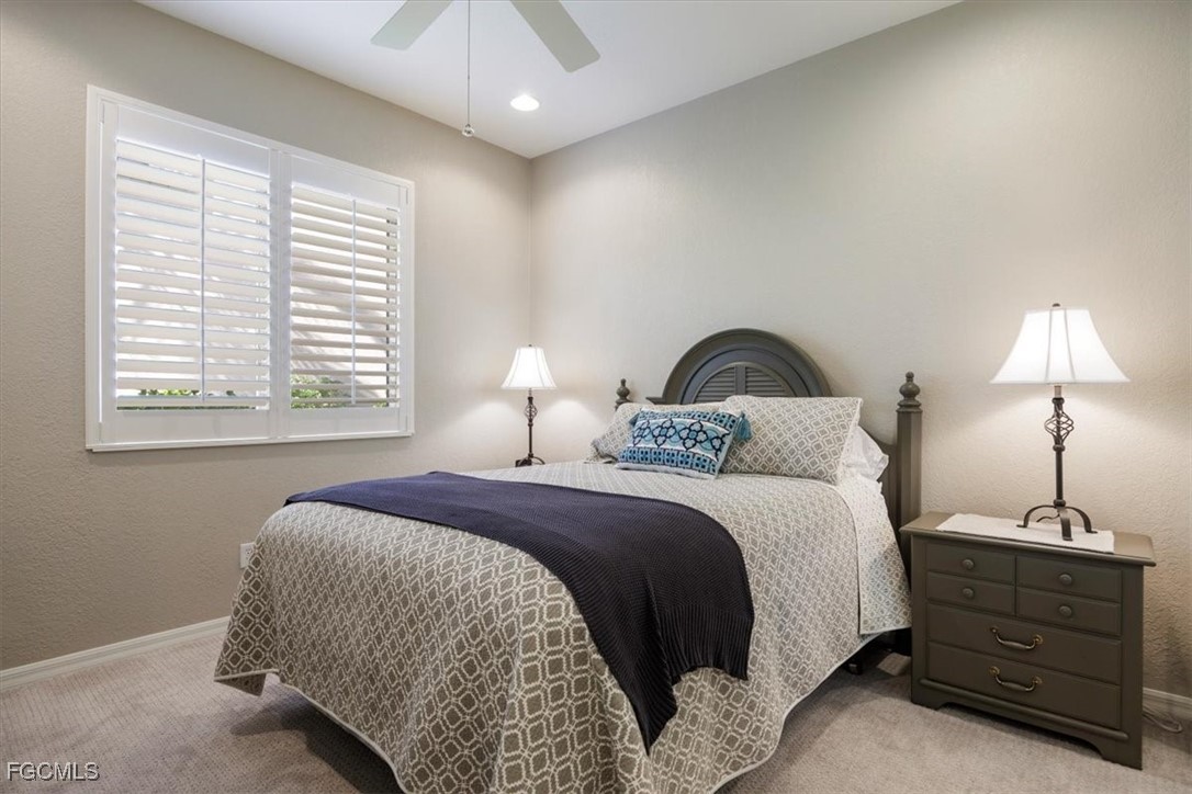9159 Spring Mountain Way Fort Myers, FL 33908 - Photo 33 of 48 a bedroom with a bed and a window