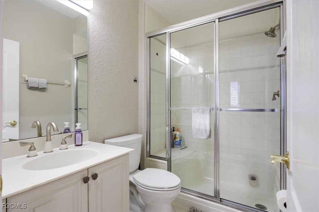 9159 Spring Mountain Way Fort Myers, FL 33908 - Photo 35 of 48 a bathroom with a sink toilet and shower
