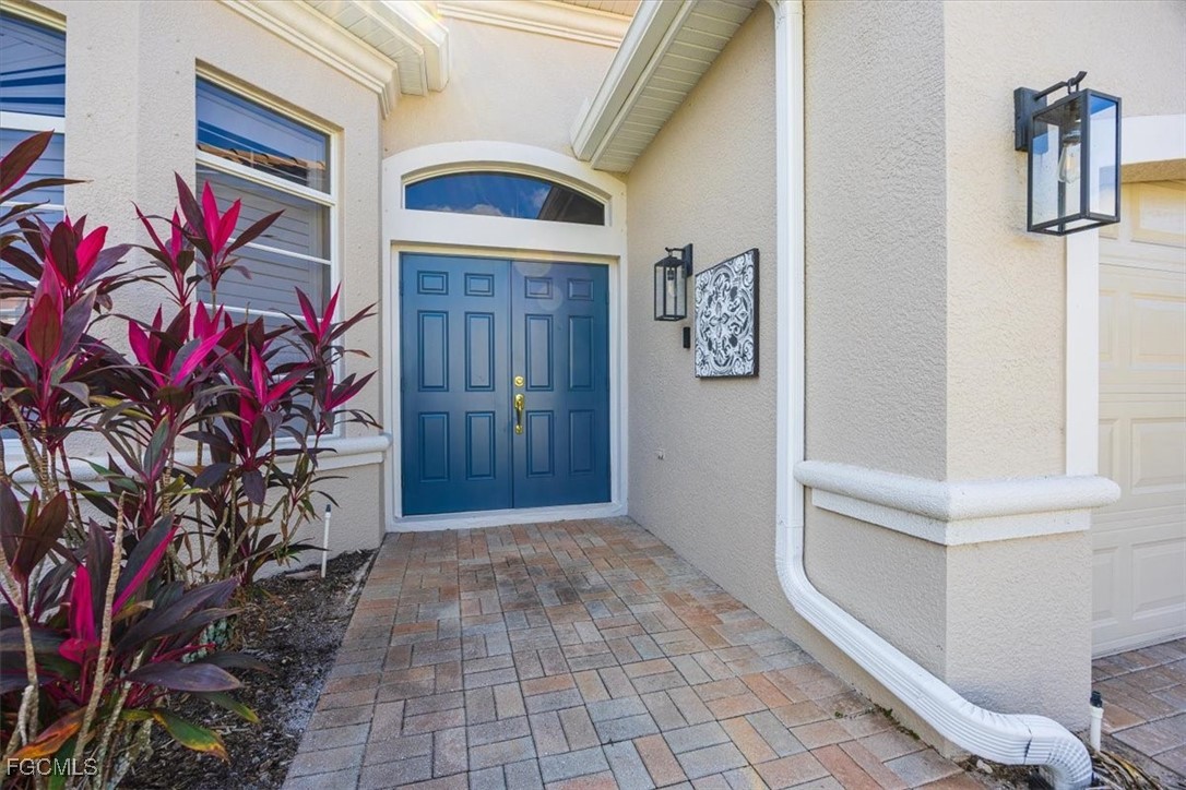 9159 Spring Mountain Way Fort Myers, FL 33908 - Photo 4 of 48 a front view of a house with entryway