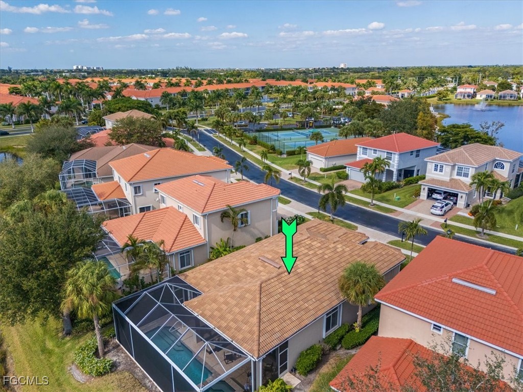 9159 Spring Mountain Way Fort Myers, FL 33908 - Photo 41 of 48 an aerial view of residential houses with outdoor space and trees