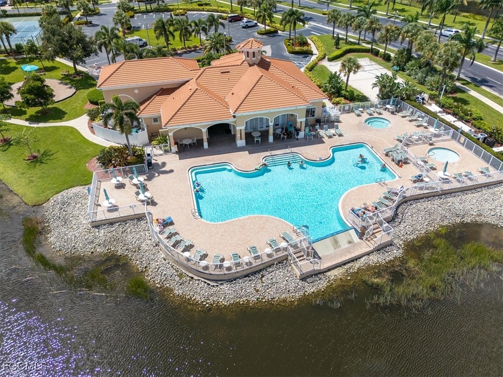 9159 Spring Mountain Way Fort Myers, FL 33908 - Photo 45 of 48 an aerial view of a house with yard swimming pool and outdoor seating