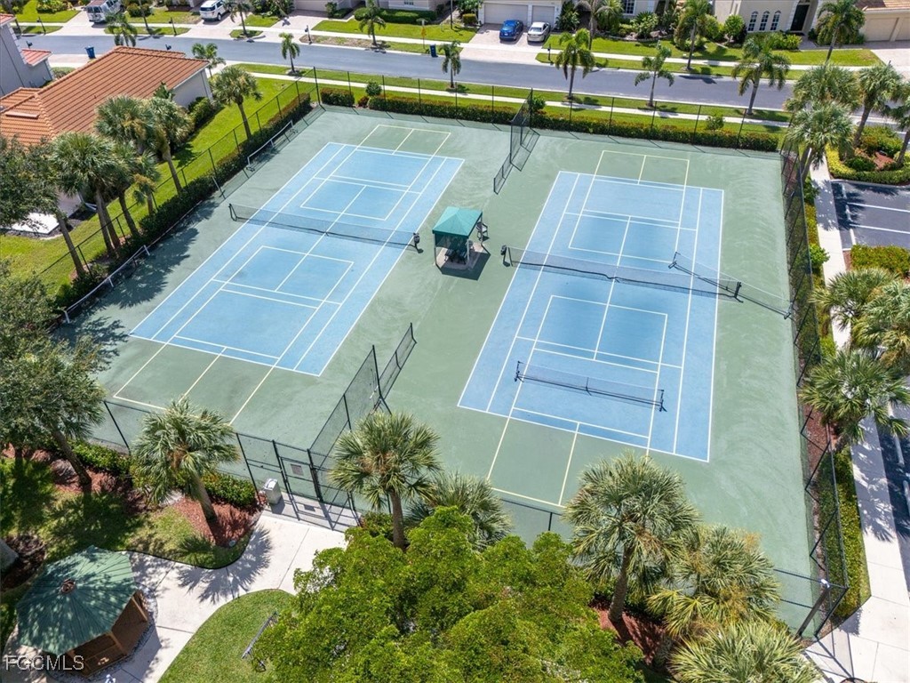 9159 Spring Mountain Way Fort Myers, FL 33908 - Photo 47 of 48 a view of a swimming pool with a patio and plants
