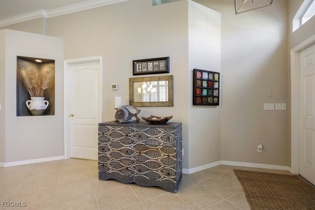 9159 Spring Mountain Way Fort Myers, FL 33908 - Photo 6 of 48 a bed room with furniture and a window