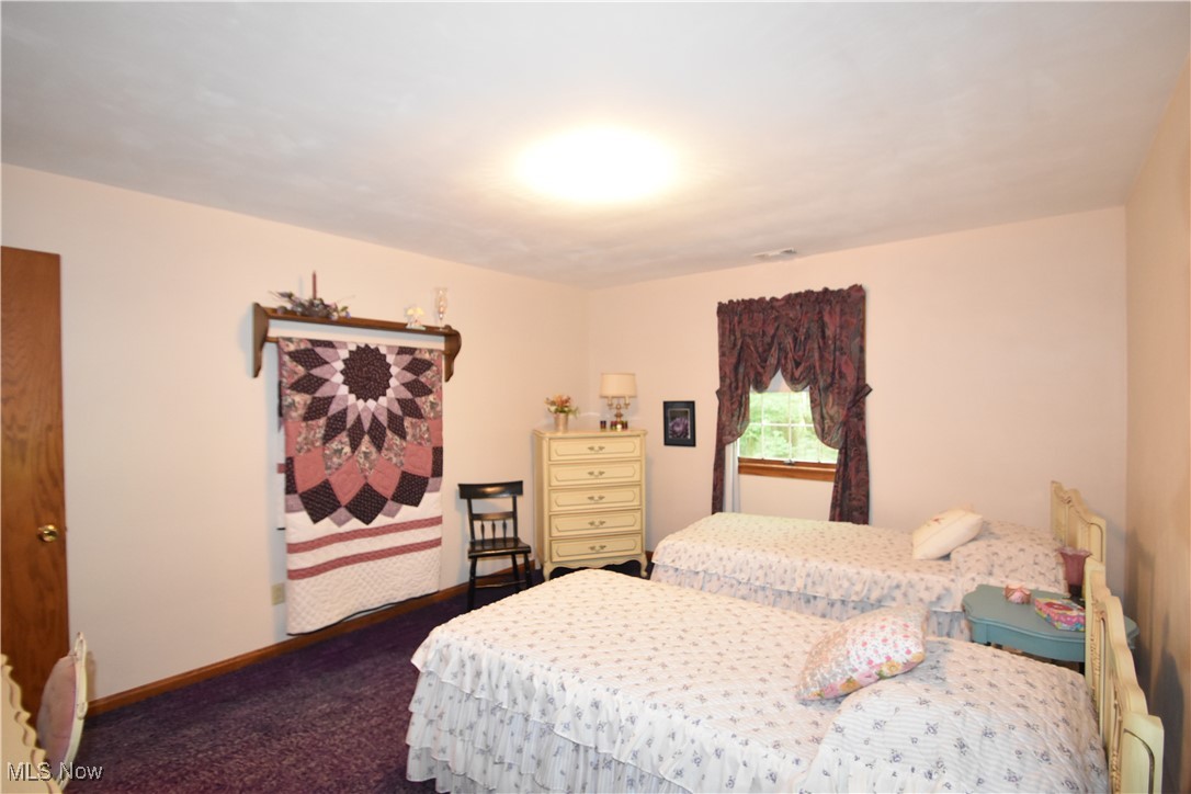 11676 Lisbon Road Salem, OH 44460 - Photo 18 of 38 Bedroom featuring dark carpet and baseboards