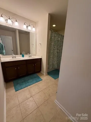 a view of bathroom with mirror and bathtub