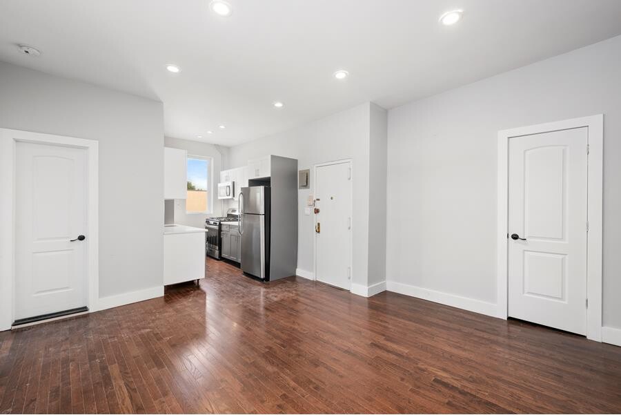 164 Dikeman Street, Unit 3R Brooklyn, NY 11231 - Photo 1 of 6 a view of a kitchen with a refrigerator and wooden floor