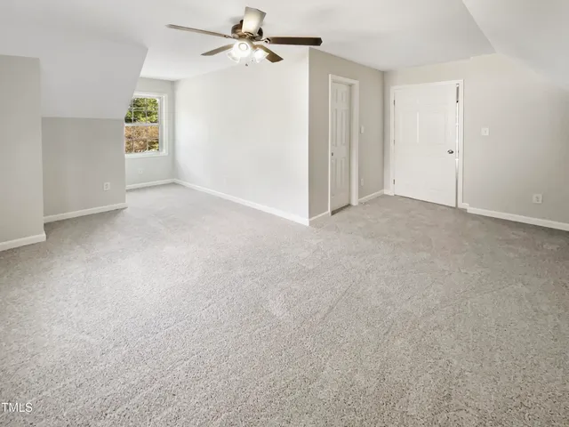 a view of empty room with closet