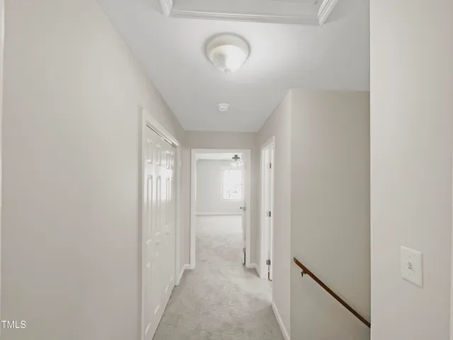 a view of a hallway with closet