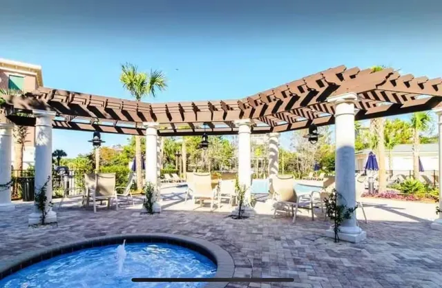 a view of a dining table and chairs