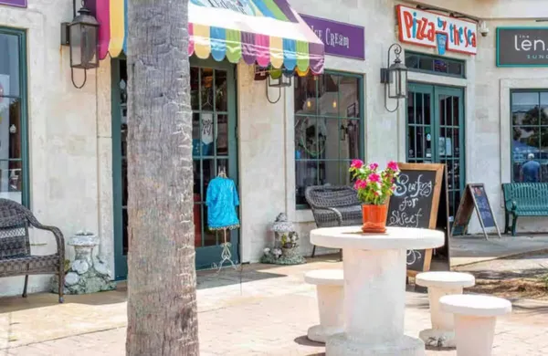 a view of multiple houses with a big yard