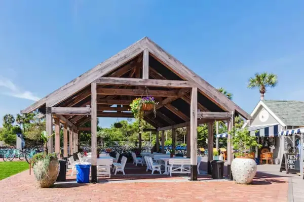 a view of a chairs and tables in patio of a house