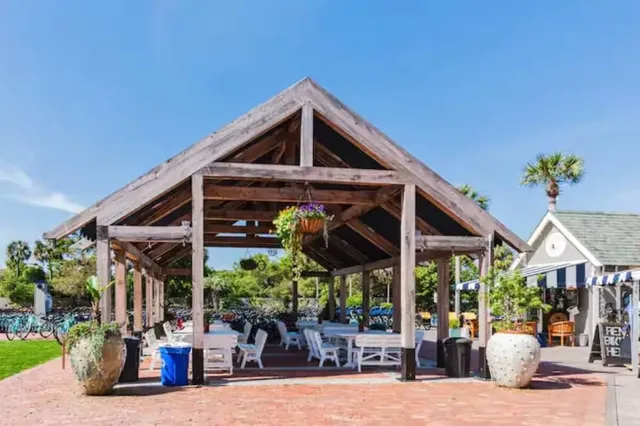 a view of a chairs and tables in patio of a house