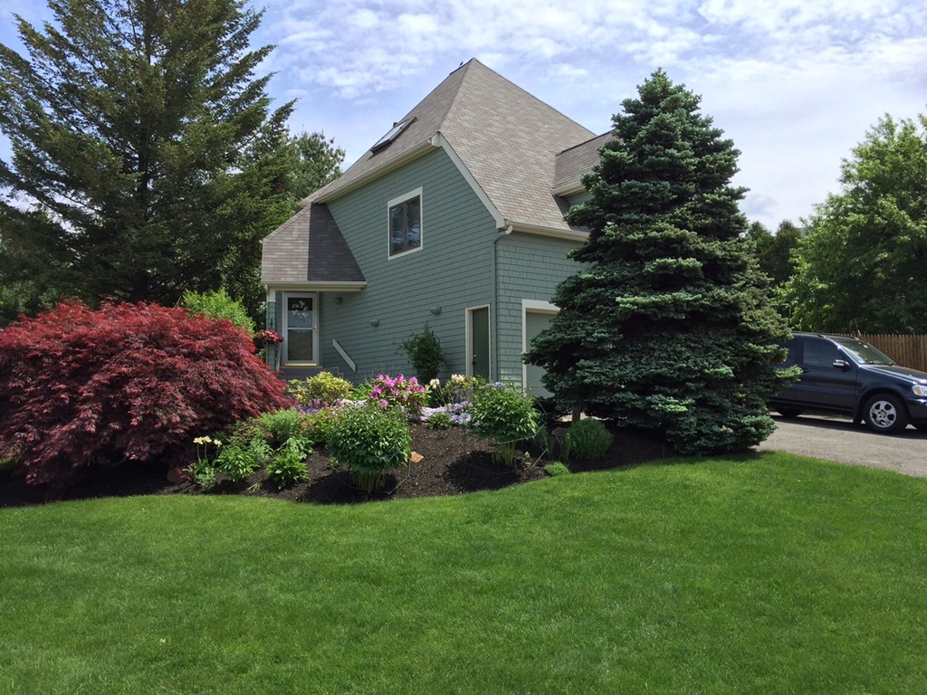 17 McKinley Road Marblehead, MA 01945 - Photo 22 of 22 a front view of a house with garden