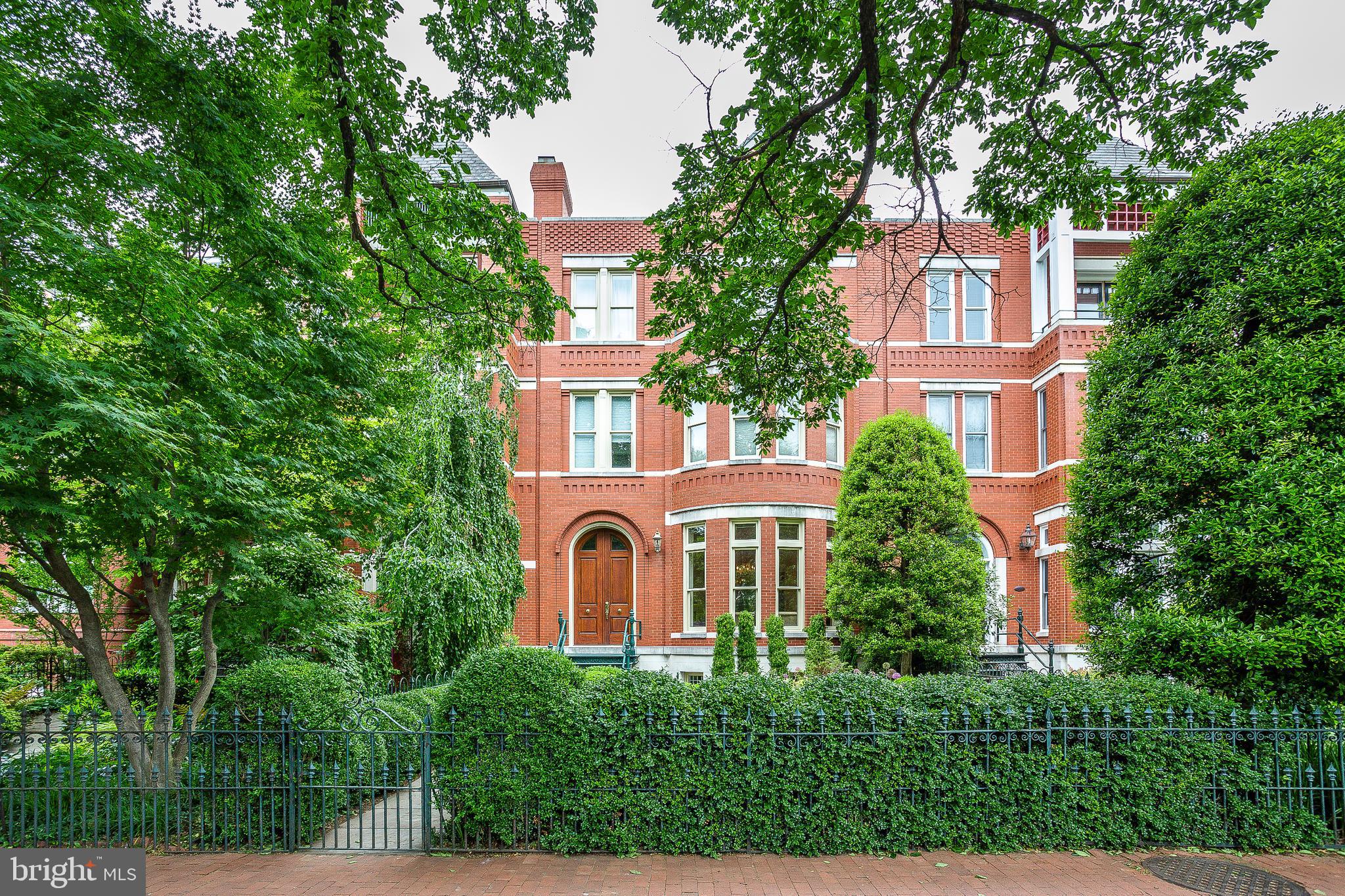 front view of a house with a tree