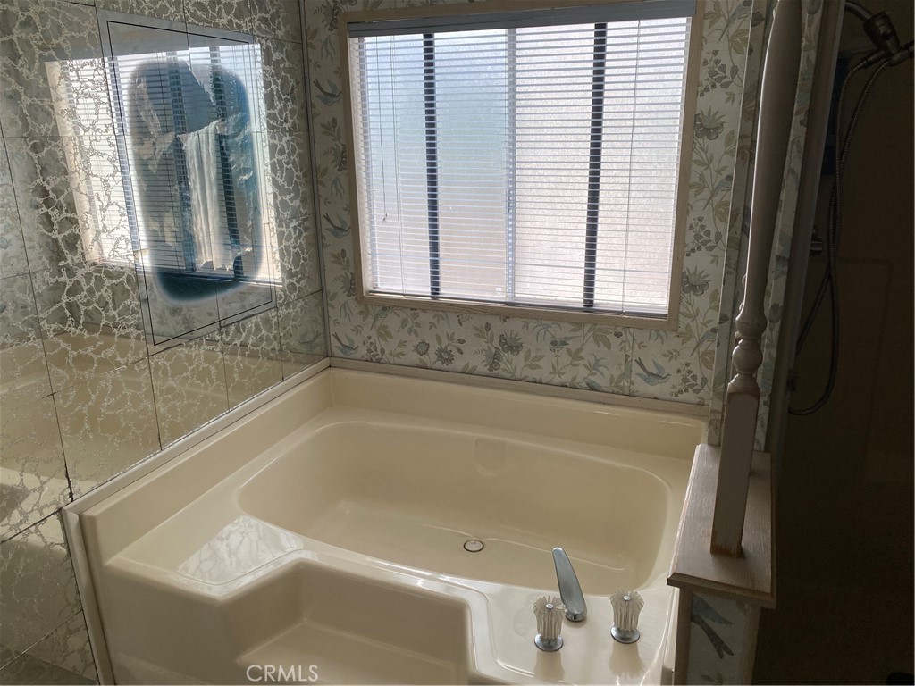 45 Walnut Via Anaheim, CA 92801 - Photo 14 of 14 a bath tub sitting in a bathroom next to a window
