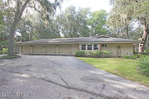 9628 Beauclerc Bluff Road Jacksonville, FL 32257 - Photo 25 of 31 a view of house with outdoor space and garden